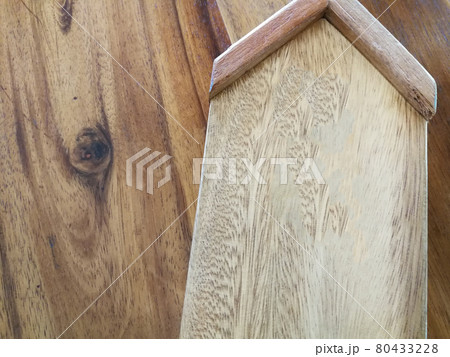 Wooden home model on wood background, copy space on wood. 80433228
