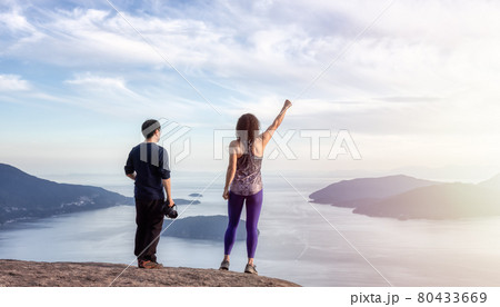 Friends hiking on top of Canadian Mountain Landscape 80433669