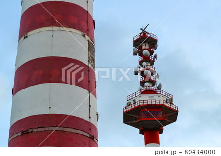 Tower communication with a variety of satellite dishes. Part of the striped lighthouse Tower communication with a variety of satellite dishes. Part of the striped lighthouse 80434000