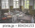 Empty Kindergarten Building. Baby cots arranged in disarray. Abandoned building in Pripyat 80434153