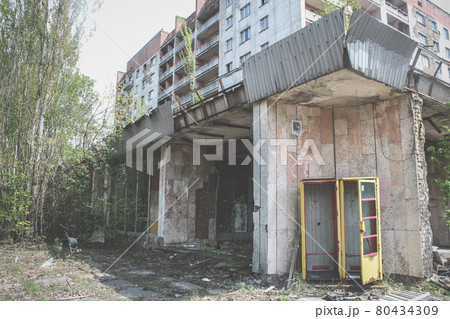 Abandoned building in Pripyat. Broken call-box or telephone box 80434309