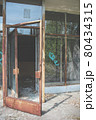 Broken open glass door. Abandoned building in Pripyat 80434315