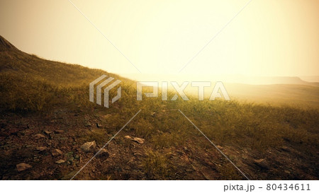 dry yellow grass on the rocky mountain with heavy fog 80434611