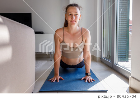 Upward facing dog yoga pose image of young woman Upward facing dog yoga pose image of young woman 80435704