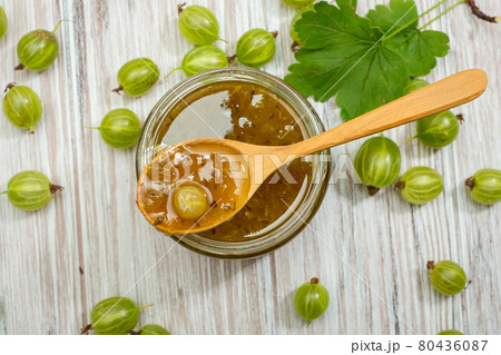Berries and jam of green gooseberries 80436087