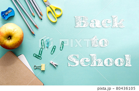 concept back to school creative top view. White chalk letters on paper. School and office supplies on a light blue paper background. Copy space, template for text or design. concept back to school creative top view. White chalk letters on paper. School and office supplies on a light blue paper background. Copy space, template for text or design. 80436105