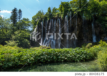 Waterfall with turquoise water in the Plitvice Lakes National Park, Croatia. Waterfall with turquoise water in the Plitvice Lakes National Park, Croatia. 80436175