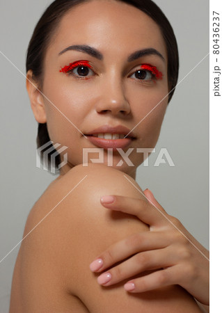 Closeup portrait of a woman with developing straight hair. Sweet tender young girl, brunette. Nude lipstick on the lips, transparent transparent skin. Beauty, spa, injections, cosmetology, beautiful Closeup portrait of a woman with developing straight hair. Sweet tender young girl, brunette. Nude lipstick on the lips, transparent transparent skin. Beauty, spa, injections, cosmetology, beautiful 80436237