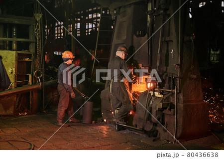 Worker controlling metal melting in furnaces Worker controlling metal melting in furnaces 80436638