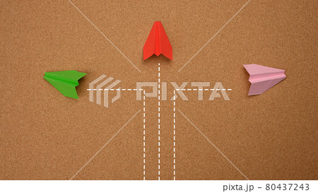 three paper airplanes fly in different directions on a brown background. Concepts of decisions, disunity of thinking 80437243