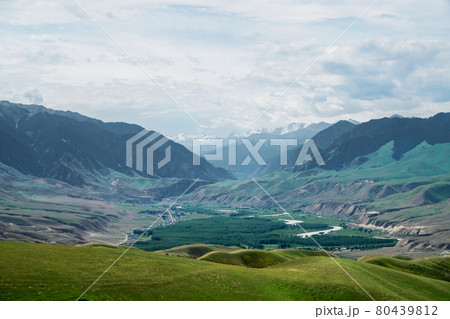 Grassland and mountains in a sunny day. Grassland and mountains in a sunny day. 80439812