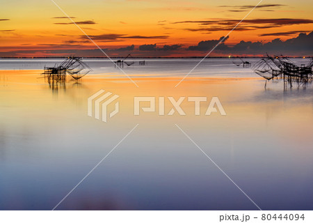 Beautiful landscape morning sky sunrise, Fishing using giant nets Thale Noi Wetlands 80444094
