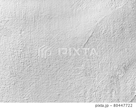 漆喰の様な背景 白い背景 テクスチャのある背景 白っぽい背景の写真素材