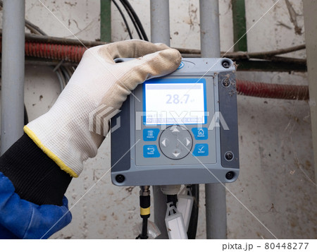 The industrial control panel shows the current temperature. The industrial control panel shows the current temperature. 80448277