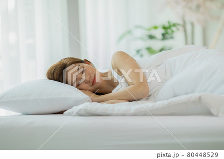 Beautiful Attractive Asian woman sleep and sweet dream lying on bed in cozy bedroom in the morning,Young girl sleep on bed relax and comfortable,Sleep and Rest Healthcare Concept Beautiful Attractive Asian woman sleep and sweet dream lying on bed in cozy bedroom in the morning,Young girl sleep on bed relax and comfortable,Sleep and Rest Healthcare Concept 80448529