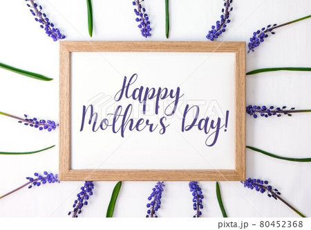 HAPPY MOTHERS DAY Postcard layout. Flat lay, top view. Blue hyacinths in row square shape. Greeting card for holiday. Grape Hyacinth Muscari 80452368