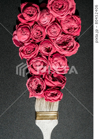 Paint brush drawing with pink flowers on black background. The concept of spring and international womens mothers day. Floral painting and decoration creative Paint brush drawing with pink flowers on black background. The concept of spring and international womens mothers day. Floral painting and decoration creative 80452406