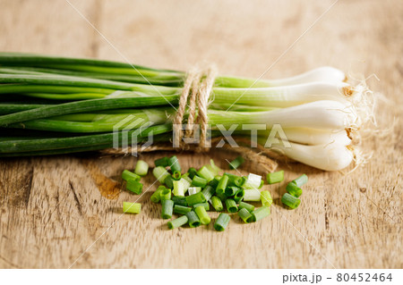 fresh green onions on wooden background fresh green onions on wooden background 80452464