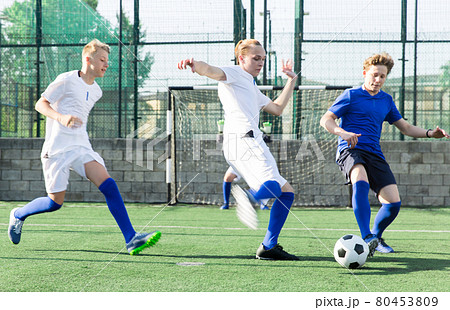 Young football players fighting for ball 80453809