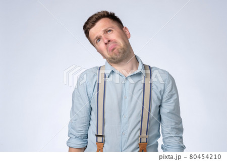 Angry emotion on face of young man. Man is about to start crying. 80454210