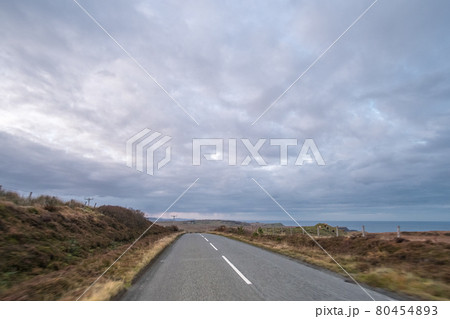 Road with Scenic Landscape View of Mountain, Forest in Scottish Highlands. Concept of Road trip, vacation. Road with Scenic Landscape View of Mountain, Forest in Scottish Highlands. Concept of Road trip, vacation. 80454893