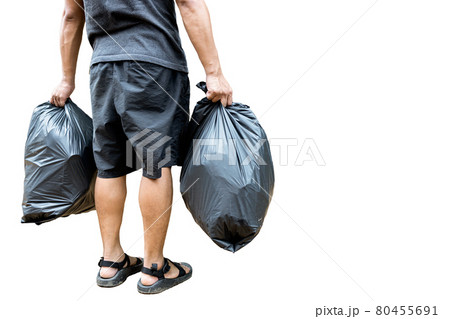 Back view,Man holding a black trash bag containing garbage in his hands,two plastic bags of rubbish for separating recycling and general waste,sorting waste for disposal,isolated on white background 80455691