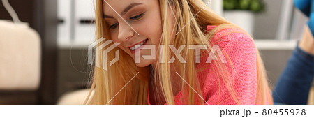 young beautiful blond woman lie on the floor read book young beautiful blond woman lie on the floor read book 80455928