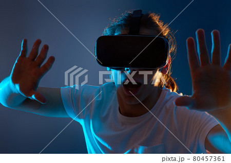 Young man using virtual reality headset. VR gadgets 80457361