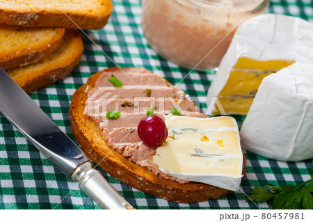 Toast with pate and soft blue cheese 80457981