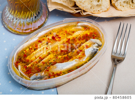 Marinated herring fillet in a plastic jar 80458605