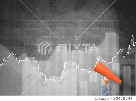 Hand of man holding red paper trumpet against graphs background 80459644