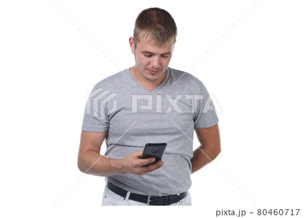 Photo of young man with bristle holding smartphone 80460717