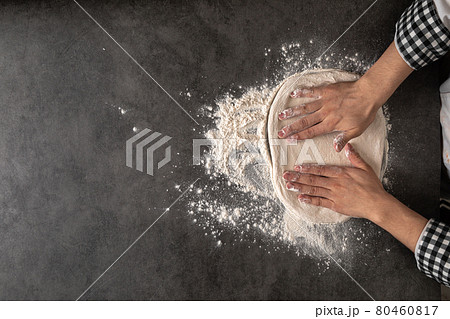 Hands making a pizza dough with flour 80460817