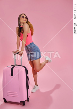 Tourist woman in summer casual clothes on pink background. Tourist woman in summer casual clothes on pink background. 80461605
