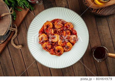 Shrimp with sweet sauce and sesame seeds dish 80464979