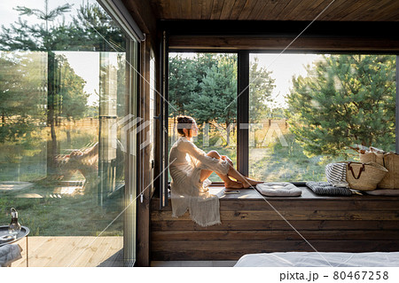 Woman enjoy nature at country house 80467258