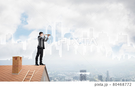 Engineer man standing on roof and looking in spyglass. Mixed media 80468772