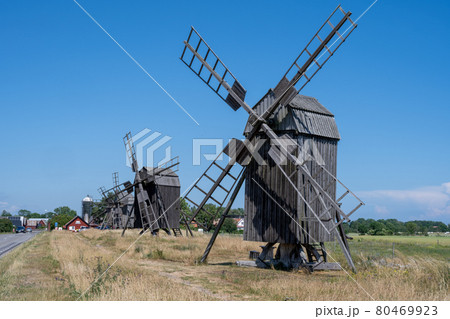 A line of old windmills on a plain A line of old windmills on a plain 80469923