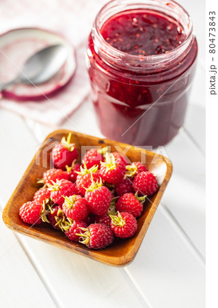 Ripe red raspberries and jam 80473843