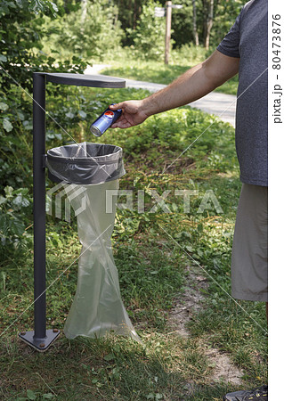a man throws an iron can of Pepsi cola in the trash can a man throws an iron can of Pepsi cola in the trash can 80473876