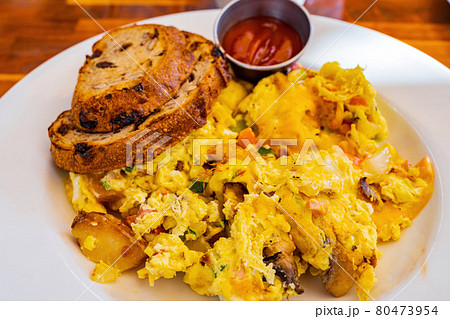 Close up shot of a plate of fried egg with wheat bread 80473954
