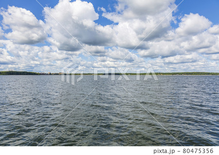 Picturesque lake in the countryside on a sunny summer day Picturesque lake in the countryside on a sunny summer day 80475356
