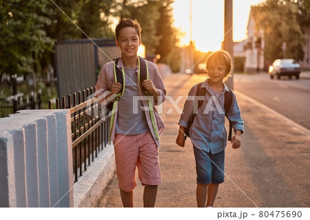 School boys running to school. School boys having fun after school. School boys running to school. School boys having fun after school. 80475690