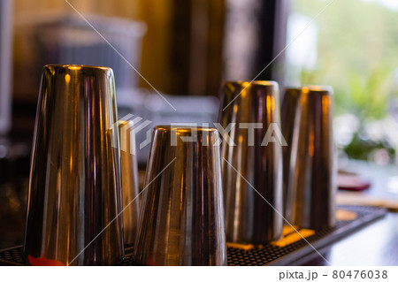 Glass of sugar and shaker on table in coffee shop. Restaurant business, table setting and cafe design. 80476038