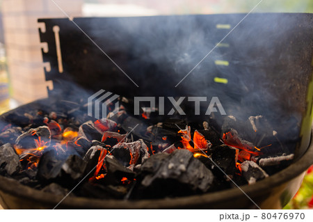 Stock image of charcoal fire grill, close up with live flames. 80476970