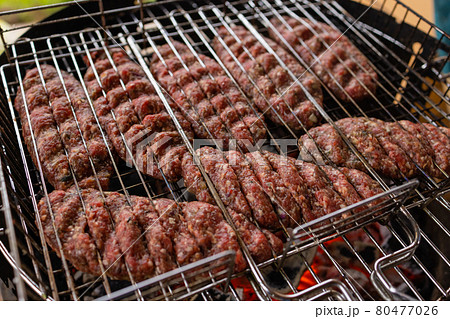 Hamburgers cooking on the grill, copy space. Hamburgers cooking on the grill, copy space. 80477026