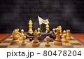Dark chess raises a white flag in surrender to bright chess on a chessboard and smoke floating in the air and dark brick background. The concept of business loss and bankruptcy. 80478204