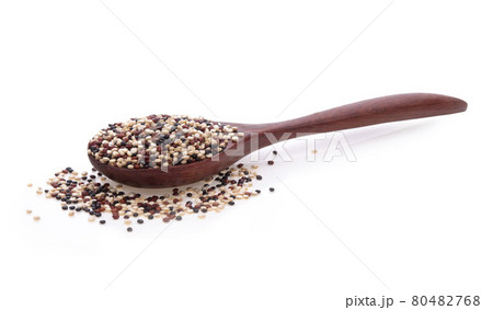 Quinoa seeds in wooden spoon isolated on white background. Quinoa seeds in wooden spoon isolated on white background. 80482768