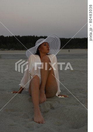 Sensual model in beachwear on sandy shore Sensual model in beachwear on sandy shore 80483036