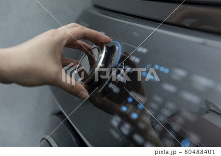 Hand using washing machine 80488401